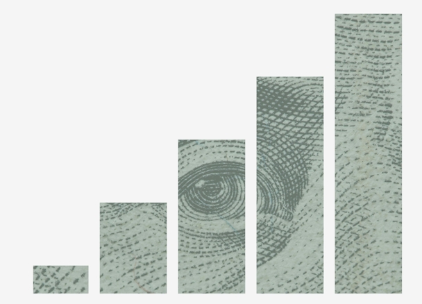 A bar chart going upwards, made of American dollar bills