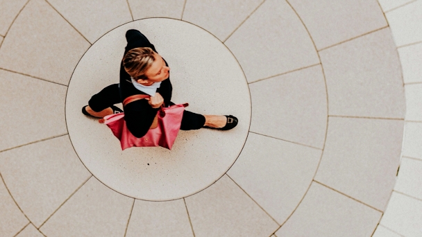 Birds eyeview of woman walking over circular paving