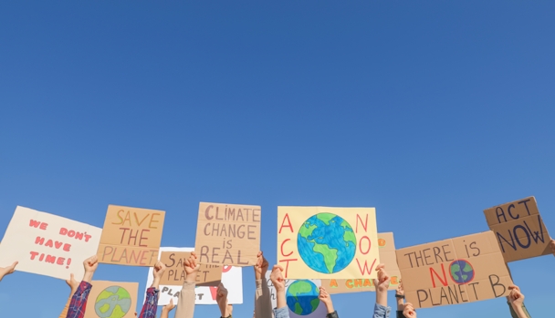 people with posters protesting against climate change