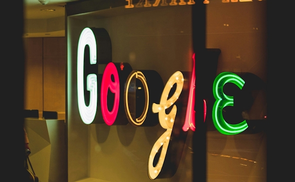 A neon google logo using unfamiliar fonts 