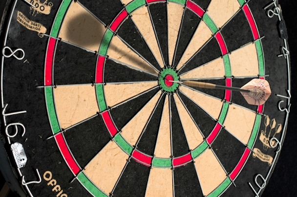 A dart board, with a dart in it