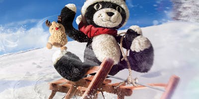 Jellycat teddy riding a sleigh in snow 