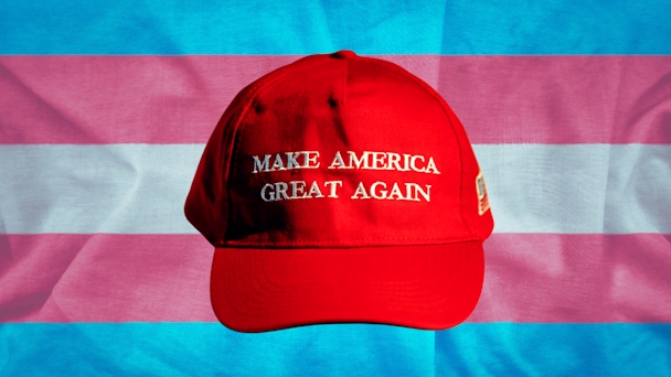 maga hat over a trans flag