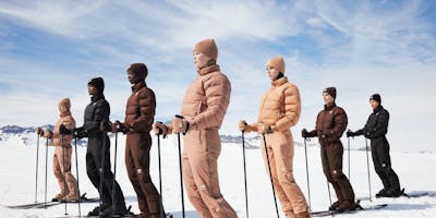 people in skin tone color ski wear