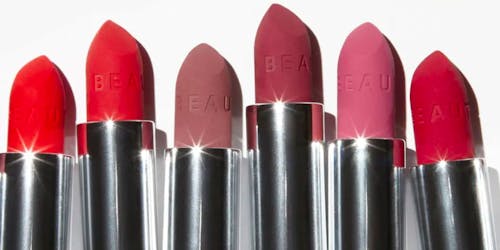 A series of different lipsticks bearing Beauty Pie branding in different shades of red and pink