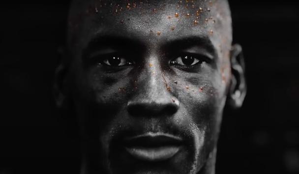 A still from Gatorade's advert featuring a close-up of a man's face with beads of orange sweat on it