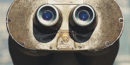 A close-up of old-fashioned viewing binoculars