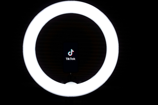 A light ring frames the TikTok logo