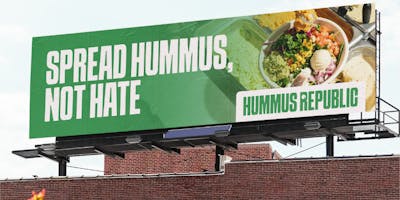 "spread hummus not hate" billboard