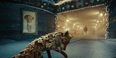 A gingerbread fox and a man walking through a tunnel in London