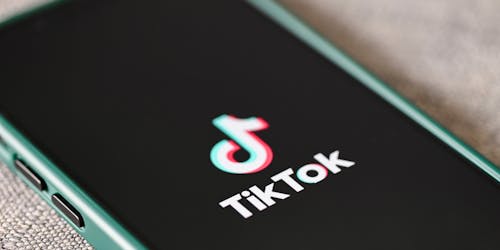 TikTok logo on mobile phone screen