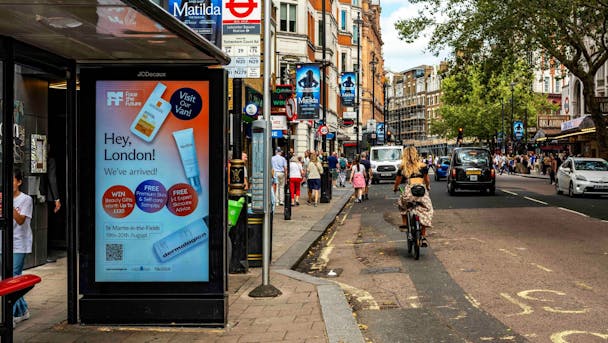 Flow City OOH ad at a bus stop on a London street