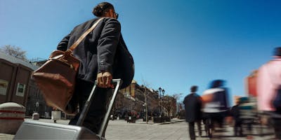 Person pulling a suitcase 